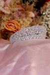 Wide band silver bridal tiara fully covered in marquise cut cubic zirconia stones in floral cluster pattern on pink satin — Feriha Bridal