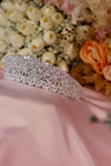 Wide band silver bridal tiara fully covered in marquise cut cubic zirconia stones in floral cluster pattern on pink satin — Feriha Bridal